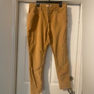 Women’s Levi’s mustard color multi button corduroy pants size 33.